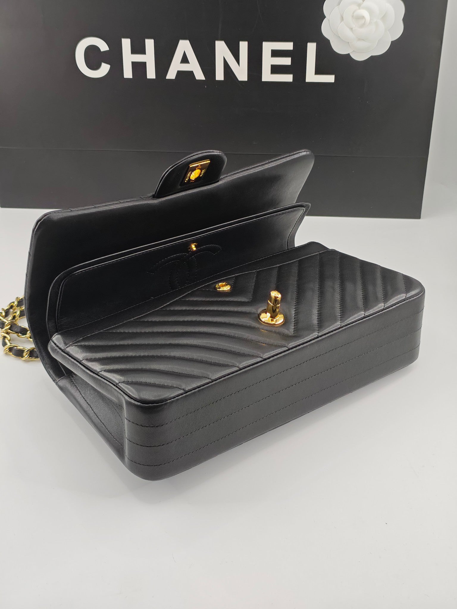 Chanel CF1112 Classic Black Gold Lambskin Bag | Stamped Chip Edition | 24K Gold Plated Hardware | Luxury Choice for Gatherings