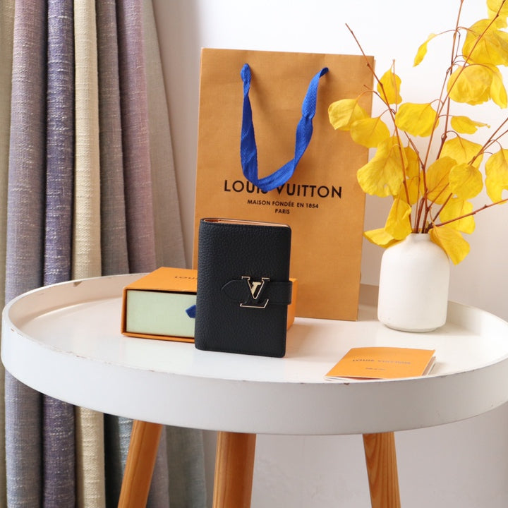 Louis Vuitton LV Vertical Compact Wallet | Grained Taurillon Leather | Capucines-Inspired Slide Lock | Multi-Card Organizer